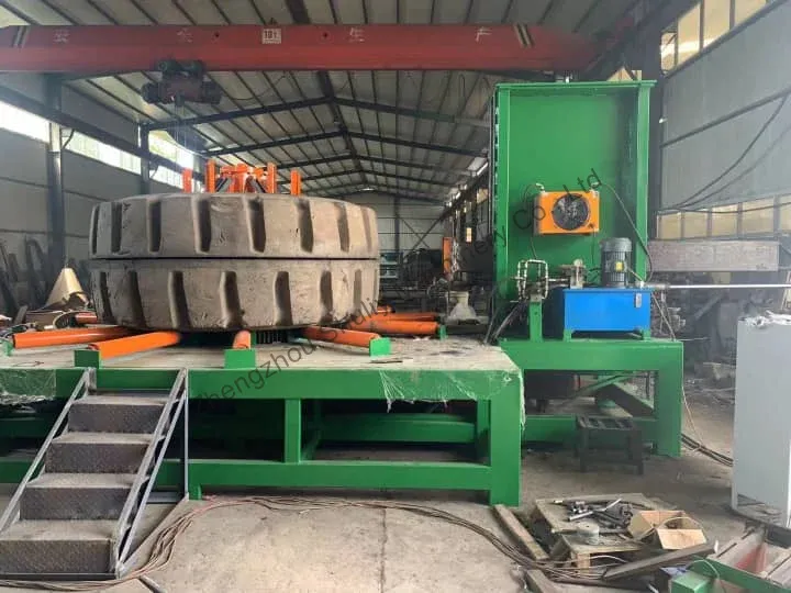 OTR tire sectioning machine